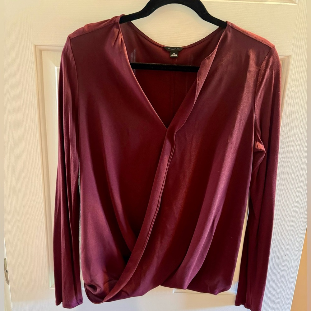 Ann Taylor blouse in burgundy with long sleeves, faux wrap style in size…